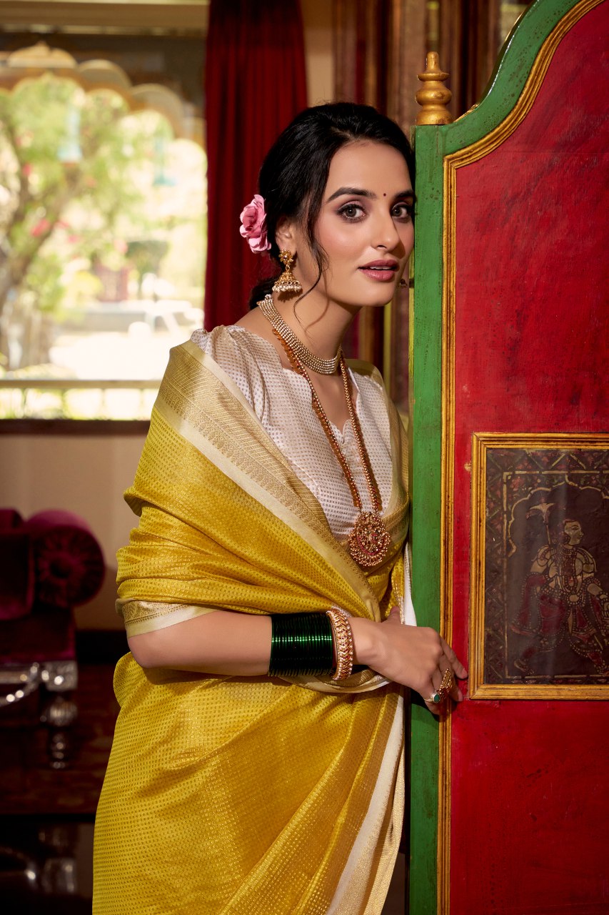 Yellow jacquard chex saree with zari weaving work blouse