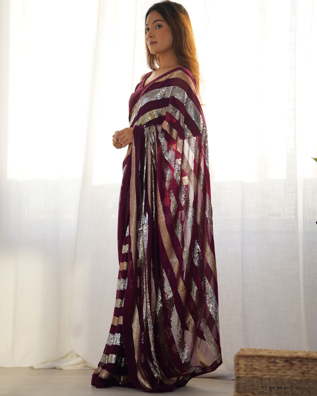 Kira Wine Georgette Saree with 3MM to 7MM sequin embroidery, elegant lining pattern and mono Banglory blouse – ideal sequin saree for wedding receptions, cocktail parties, festive wear, and premium Bollywood-style designer look.
