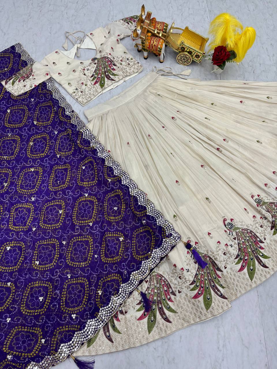 Amla off-white tissue silk lehenga choli with sequins thread work and purple Bandhej dupatta