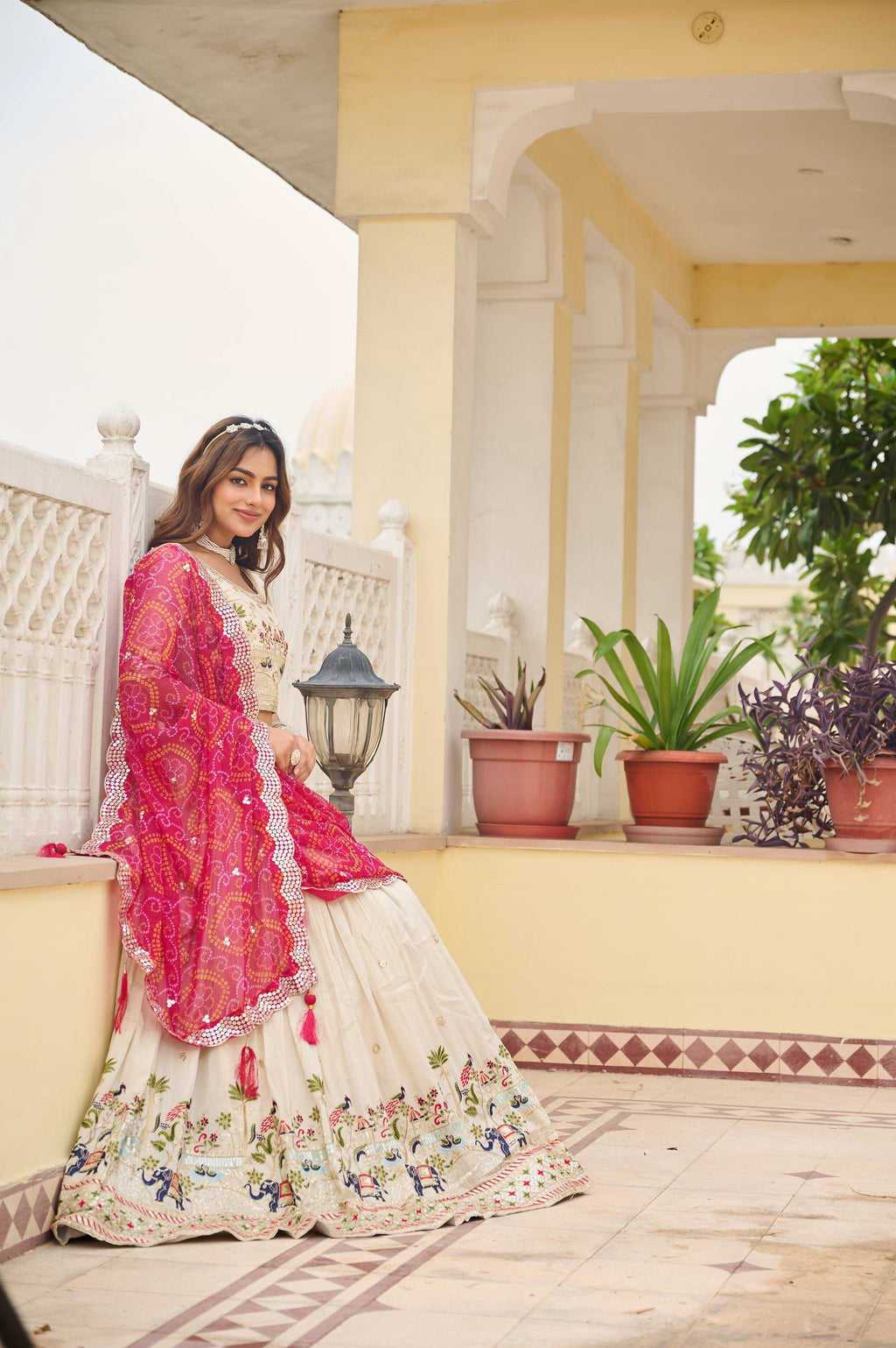 Off-white silk sequins thread embroidery lehenga choli with pink Bandhej dupatta