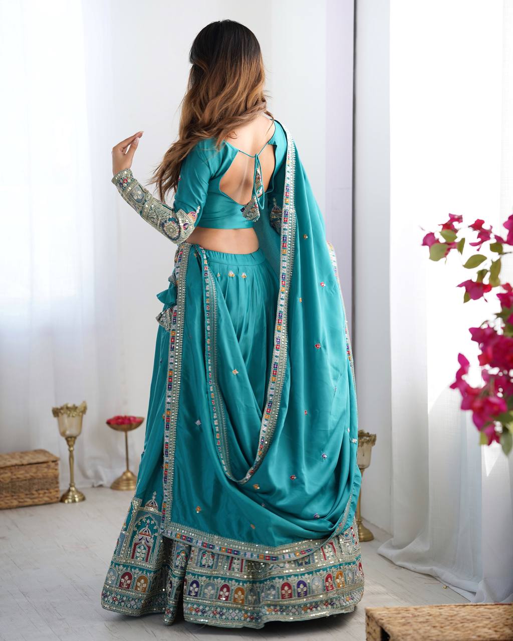 Kavyani Natural Crepe Silk Teal Color Lehenga Choli Set – semi-stitched lehenga with 3-meter flair, cancan and canvas patta, intricately embroidered with coding dori, thread, and sequins; paired with unstitched matching choli and embroidered dupatta with lace border, premium festive and wedding ethnic wear for women by Trinaari.