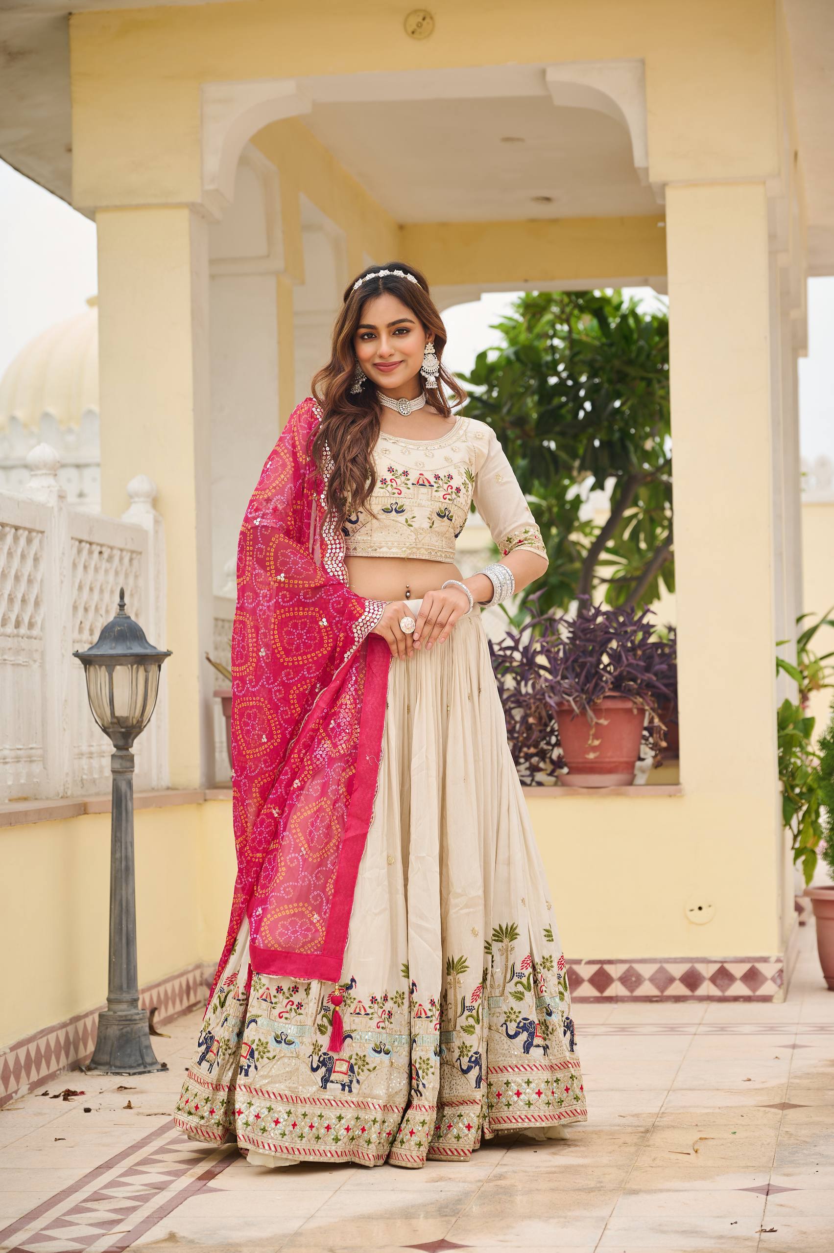 Off-white silk sequins thread embroidery lehenga choli with pink Bandhej dupatta