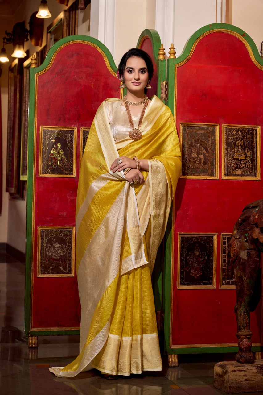Yellow jacquard chex saree with zari weaving work blouse