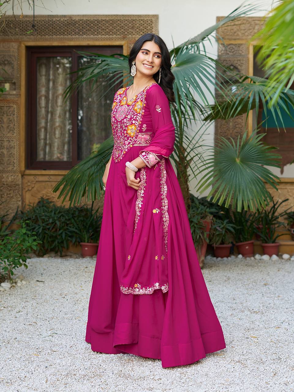 Pink heavy sequins thread embroidered georgette gown for wedding functions