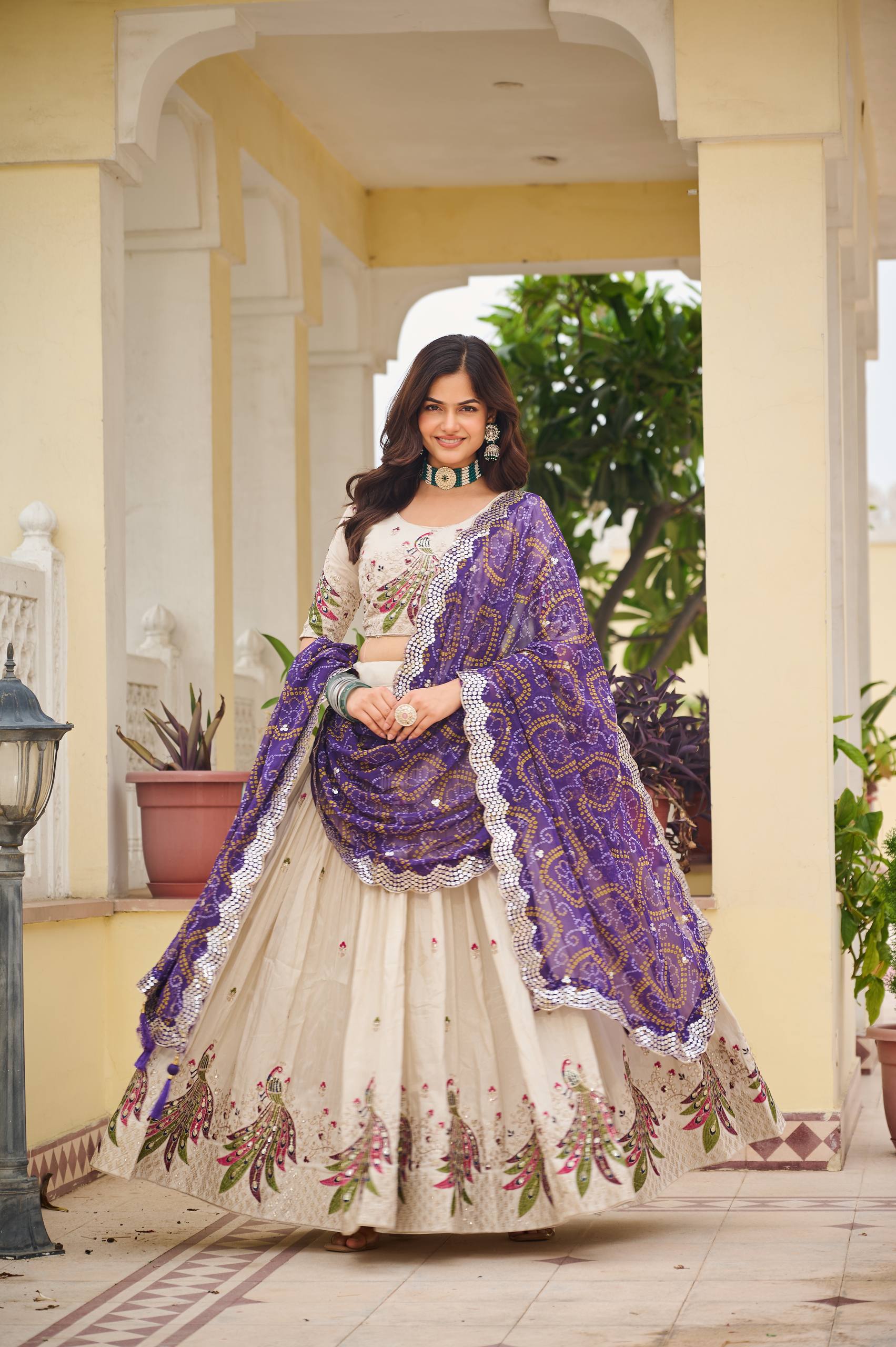 Amla off-white tissue silk lehenga choli with sequins thread work and purple Bandhej dupatta