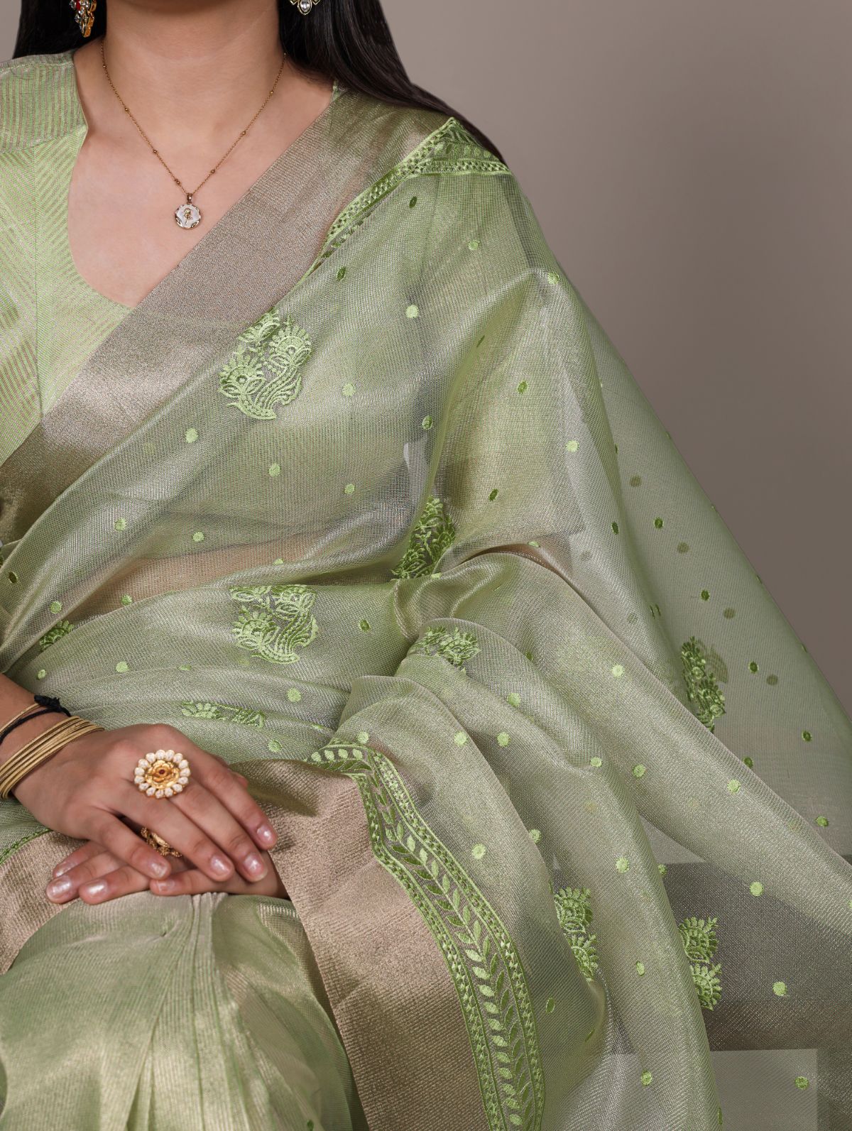 Pista green poly shimmer thread embroidered saree with unstitched blouse