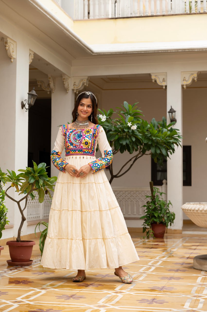Off-white cotton gown with Kutchi Gamthi mirror embroidery and lace