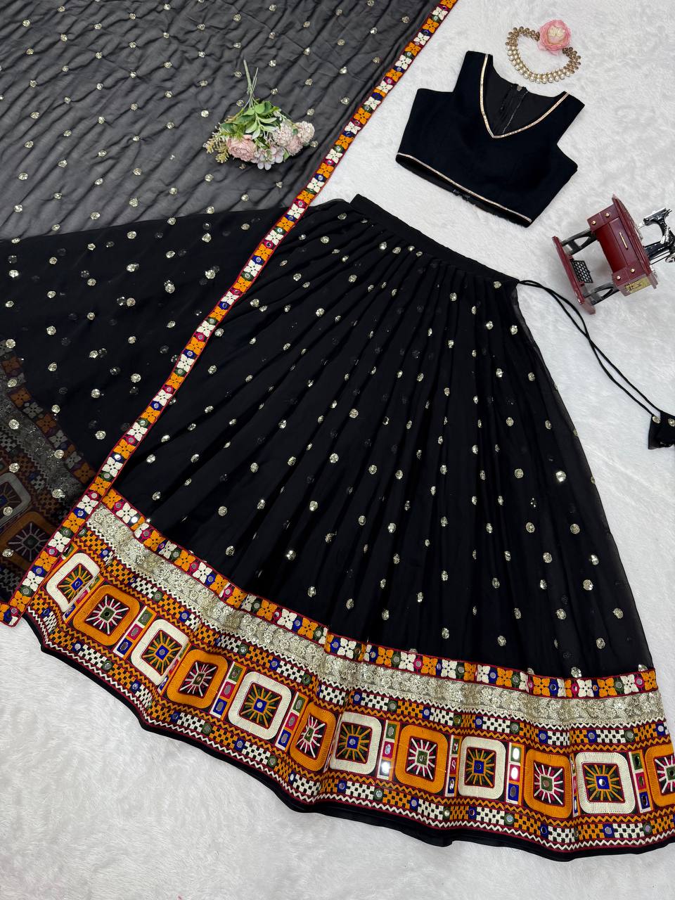Black georgette lehenga choli with Gamthi embroidery and mirror work