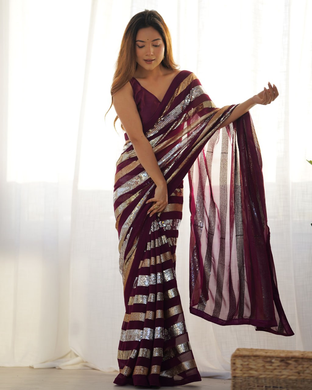 Kira Wine Georgette Saree with 3MM to 7MM sequin embroidery, elegant lining pattern and mono Banglory blouse – ideal sequin saree for wedding receptions, cocktail parties, festive wear, and premium Bollywood-style designer look.