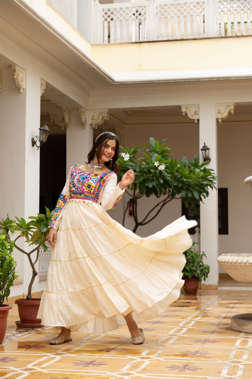 Off-white cotton gown with Kutchi Gamthi mirror embroidery and lace