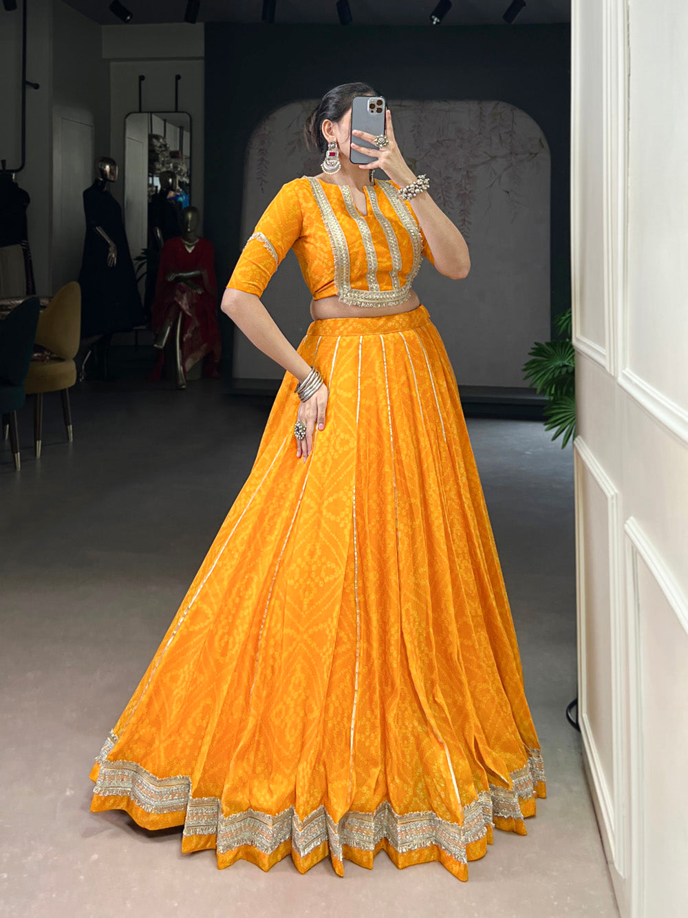 Yellow chiffon lehenga choli with Bandhej print and Gota Patti lace