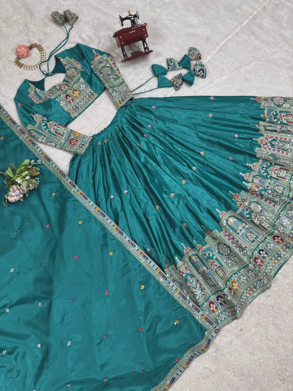 Kavyani Natural Crepe Silk Teal Color Lehenga Choli Set – semi-stitched lehenga with 3-meter flair, cancan and canvas patta, intricately embroidered with coding dori, thread, and sequins; paired with unstitched matching choli and embroidered dupatta with lace border, premium festive and wedding ethnic wear for women by Trinaari.