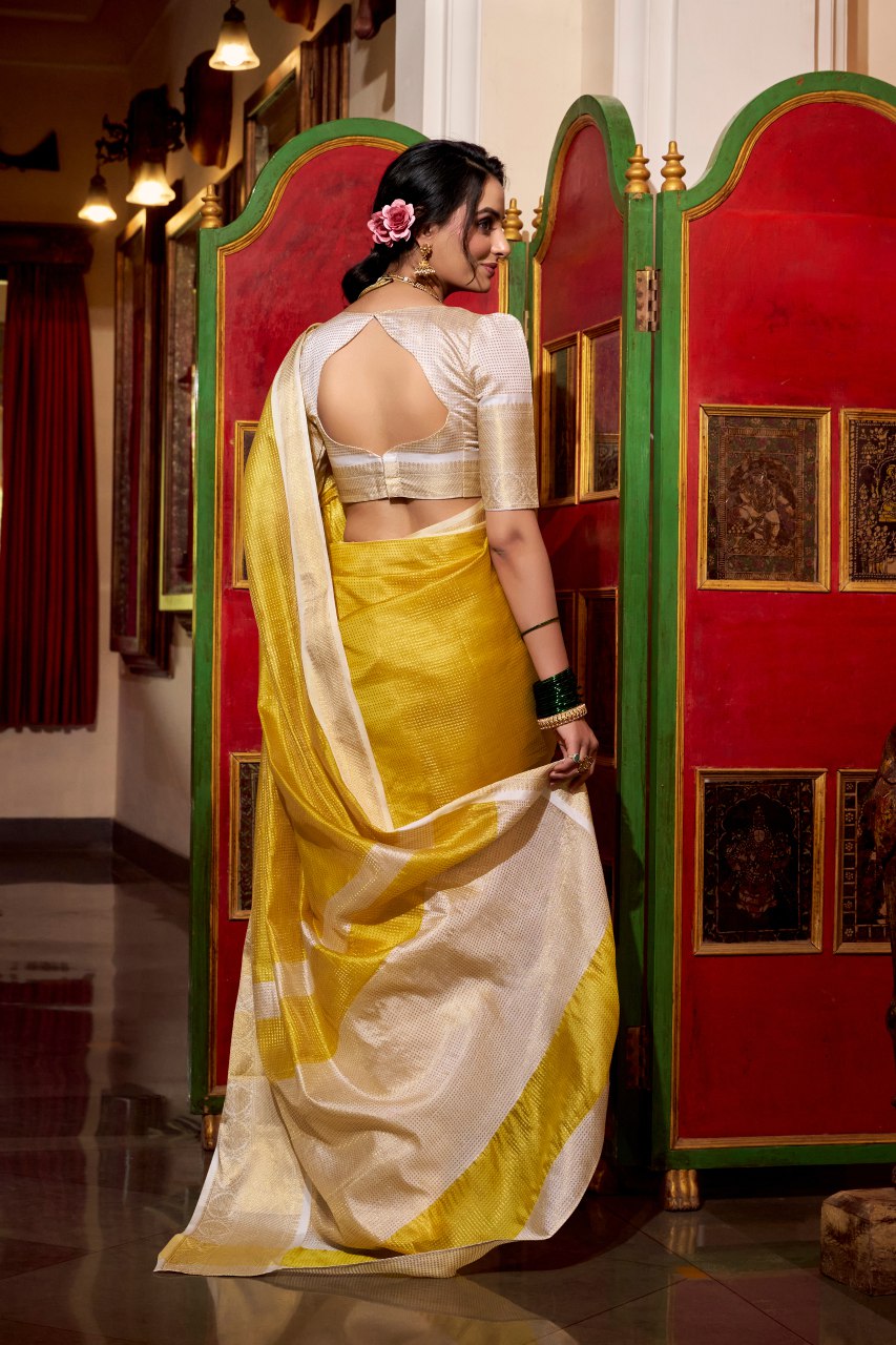 Yellow jacquard chex saree with zari weaving work blouse