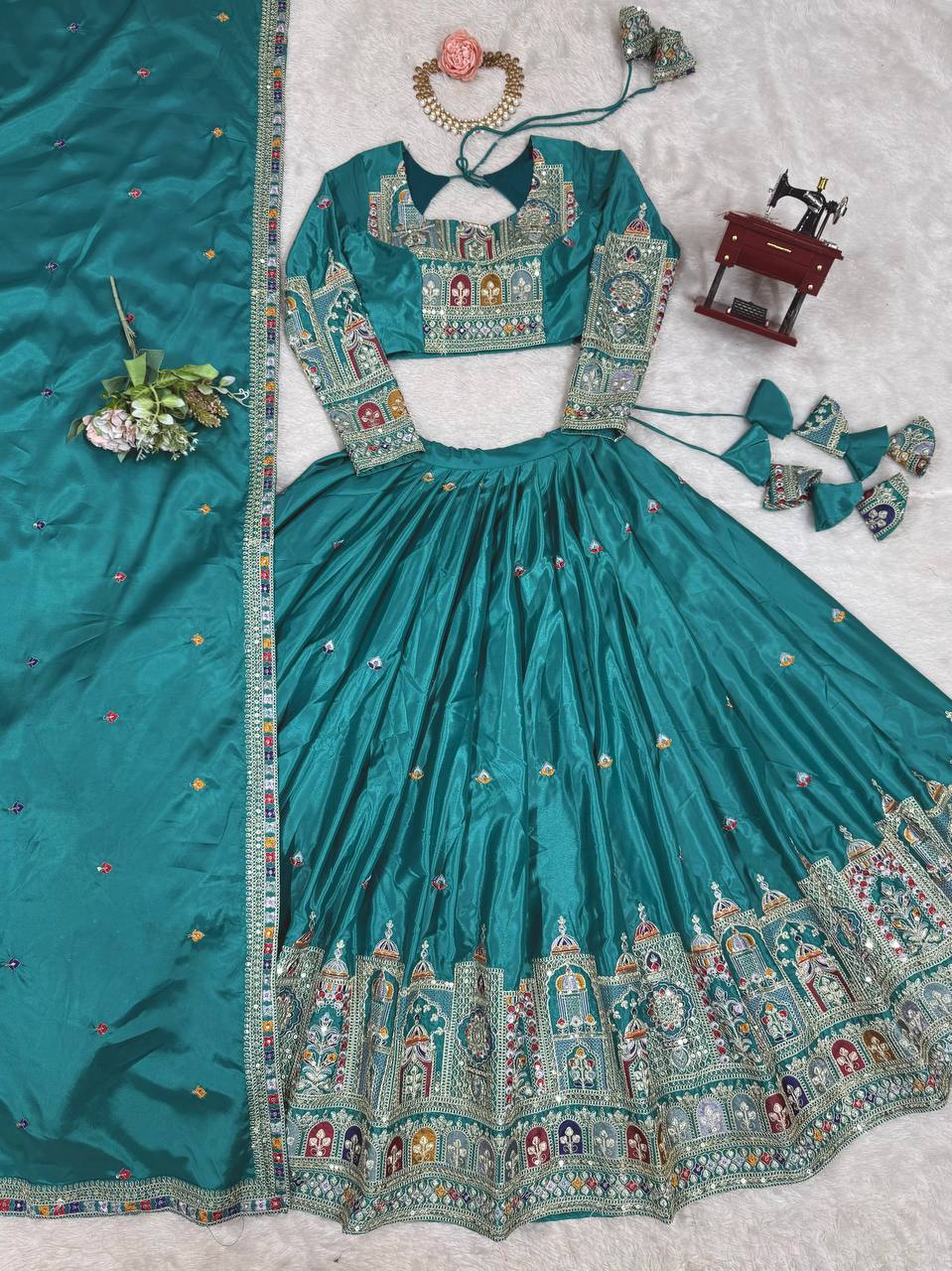 Kavyani Natural Crepe Silk Teal Color Lehenga Choli Set – semi-stitched lehenga with 3-meter flair, cancan and canvas patta, intricately embroidered with coding dori, thread, and sequins; paired with unstitched matching choli and embroidered dupatta with lace border, premium festive and wedding ethnic wear for women by Trinaari.
