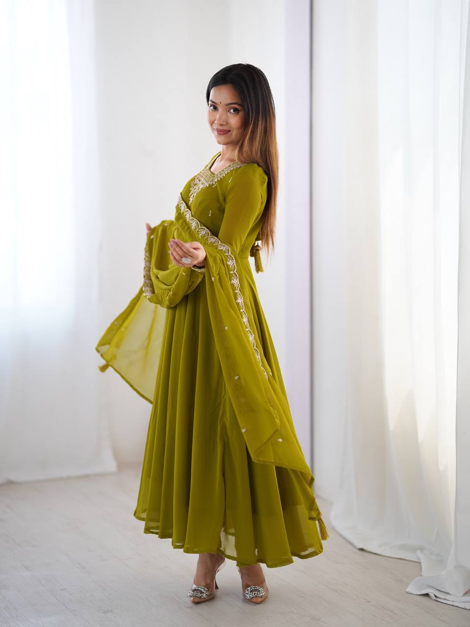 Green Anarkali suit in soft Fox Georgette with 6.5-meter flair, beads & zari embroidery, lace sleeves & dupatta – fully stitched & party-ready.
