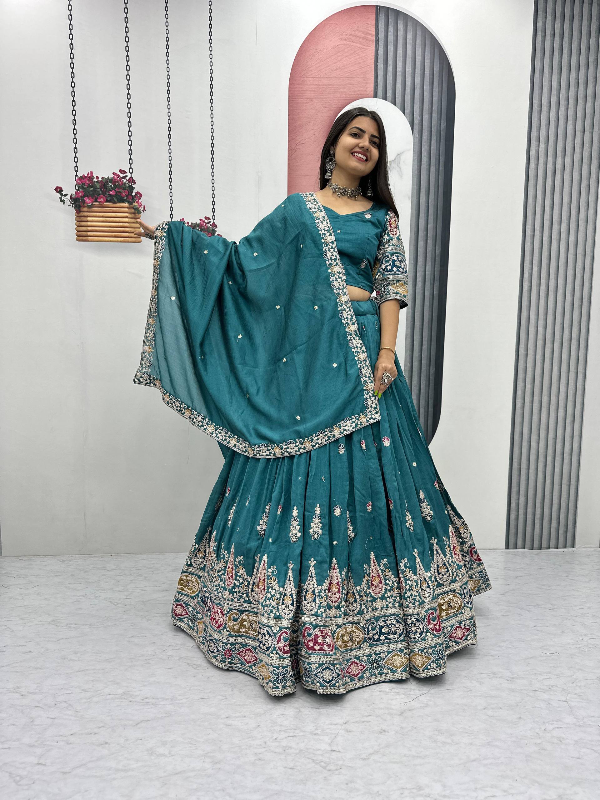 Raji teal green Vichitra silk lehenga choli with sequins thread embroidery and dupatta