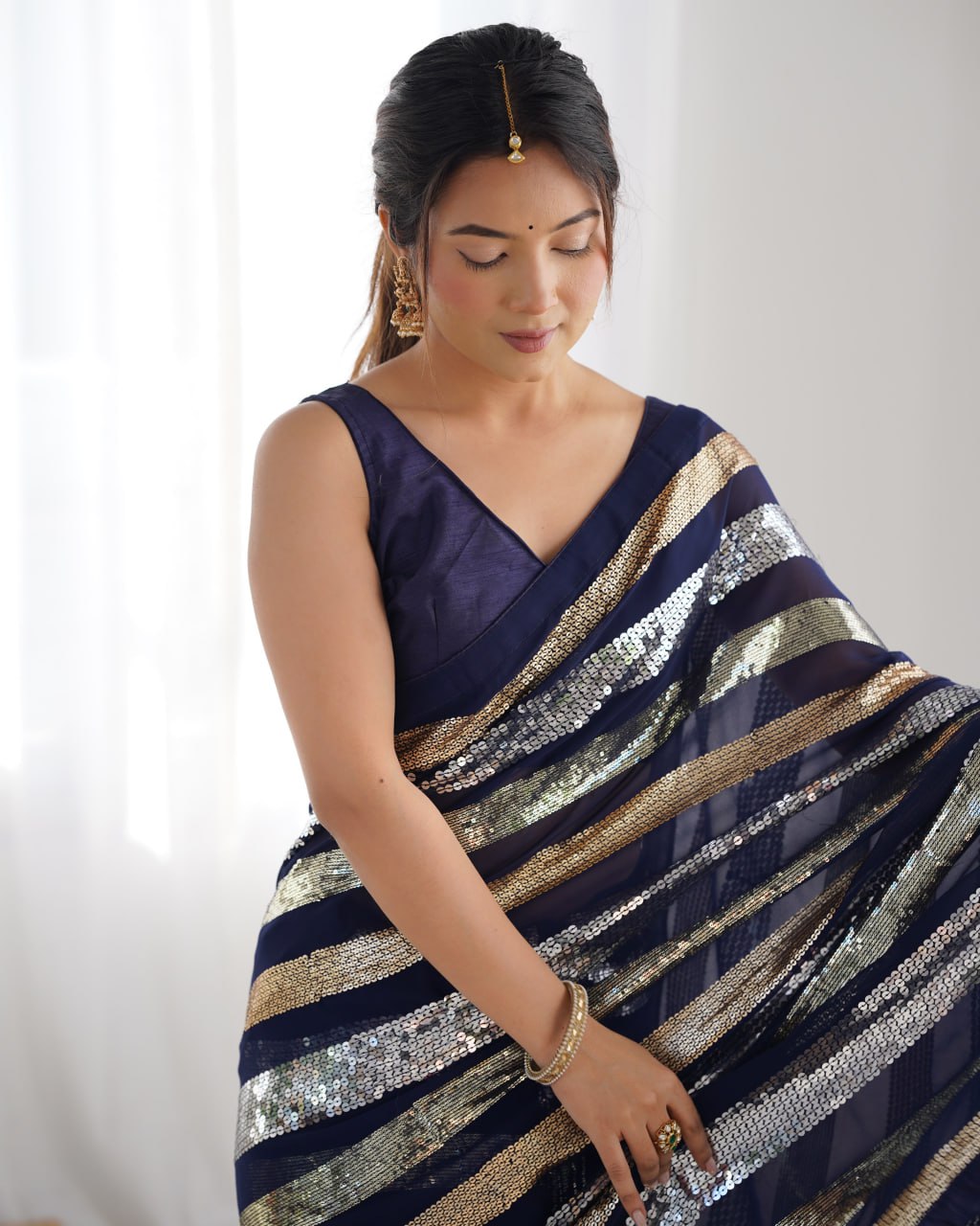 Deep blue georgette sequin embroidered Kira designer saree