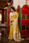 Yellow jacquard chex saree with zari weaving work blouse