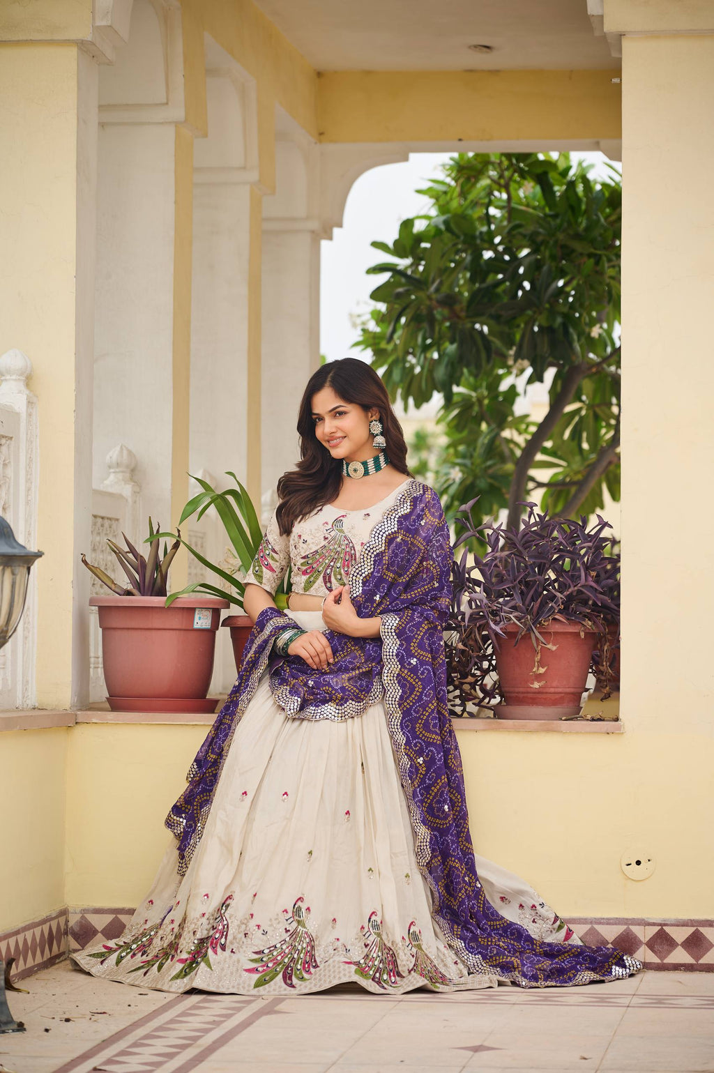 Amla off-white tissue silk lehenga choli with sequins thread work and purple Bandhej dupatta