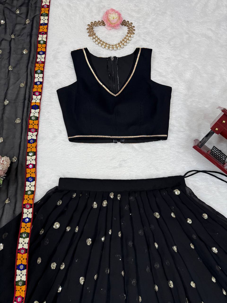 Black georgette lehenga choli with Gamthi embroidery and mirror work
