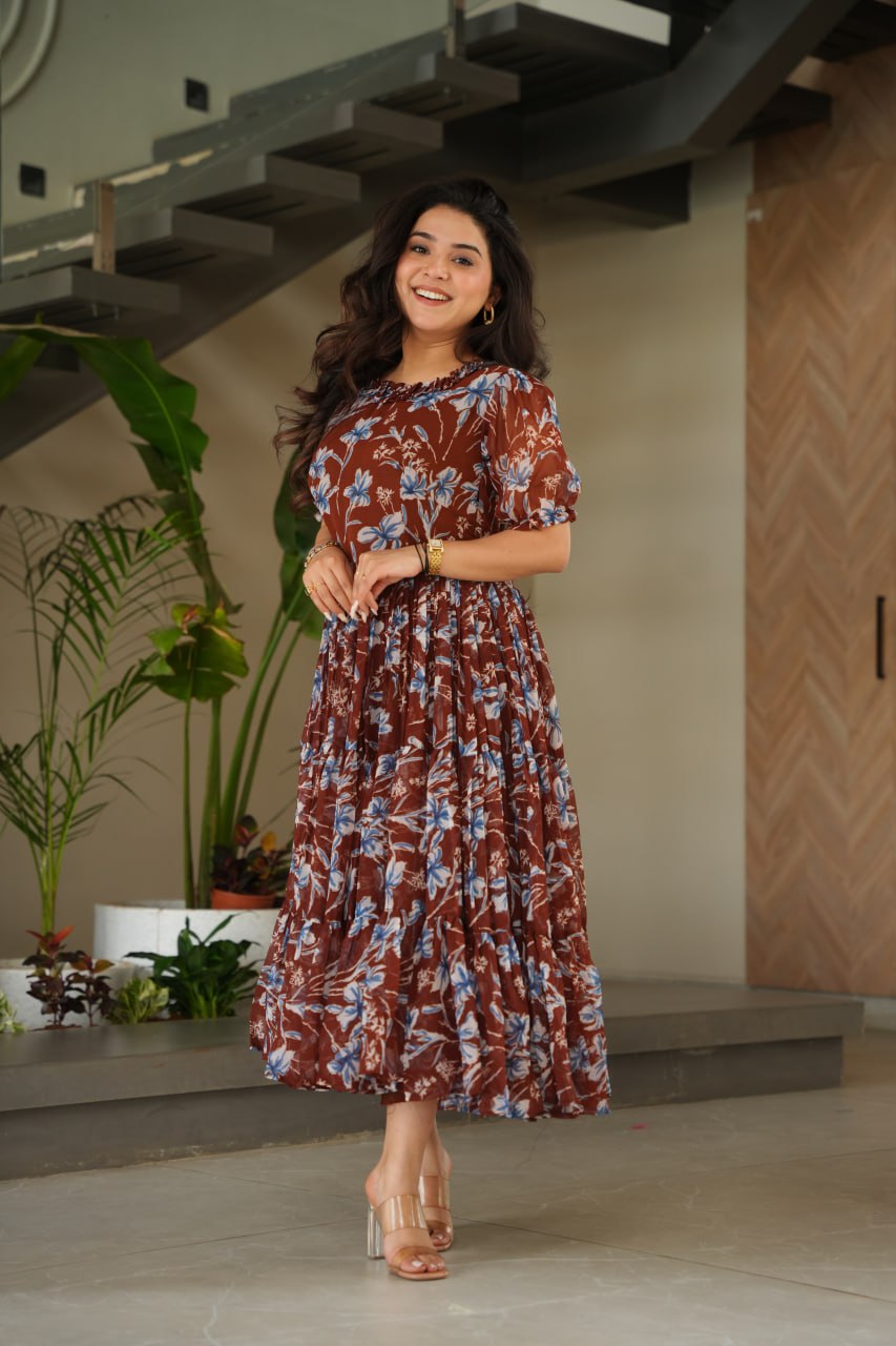 Vikarni Brown Printed Anarkali Gown in faux georgette with 12-meter flair & cotton lining – perfect for haldi, mehndi, festive & Indo-western occasions.
