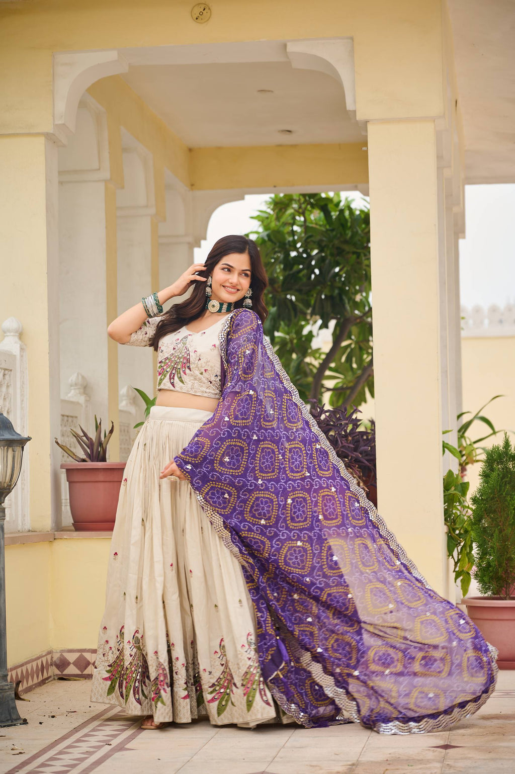 Amla off-white tissue silk lehenga choli with sequins thread work and purple Bandhej dupatta
