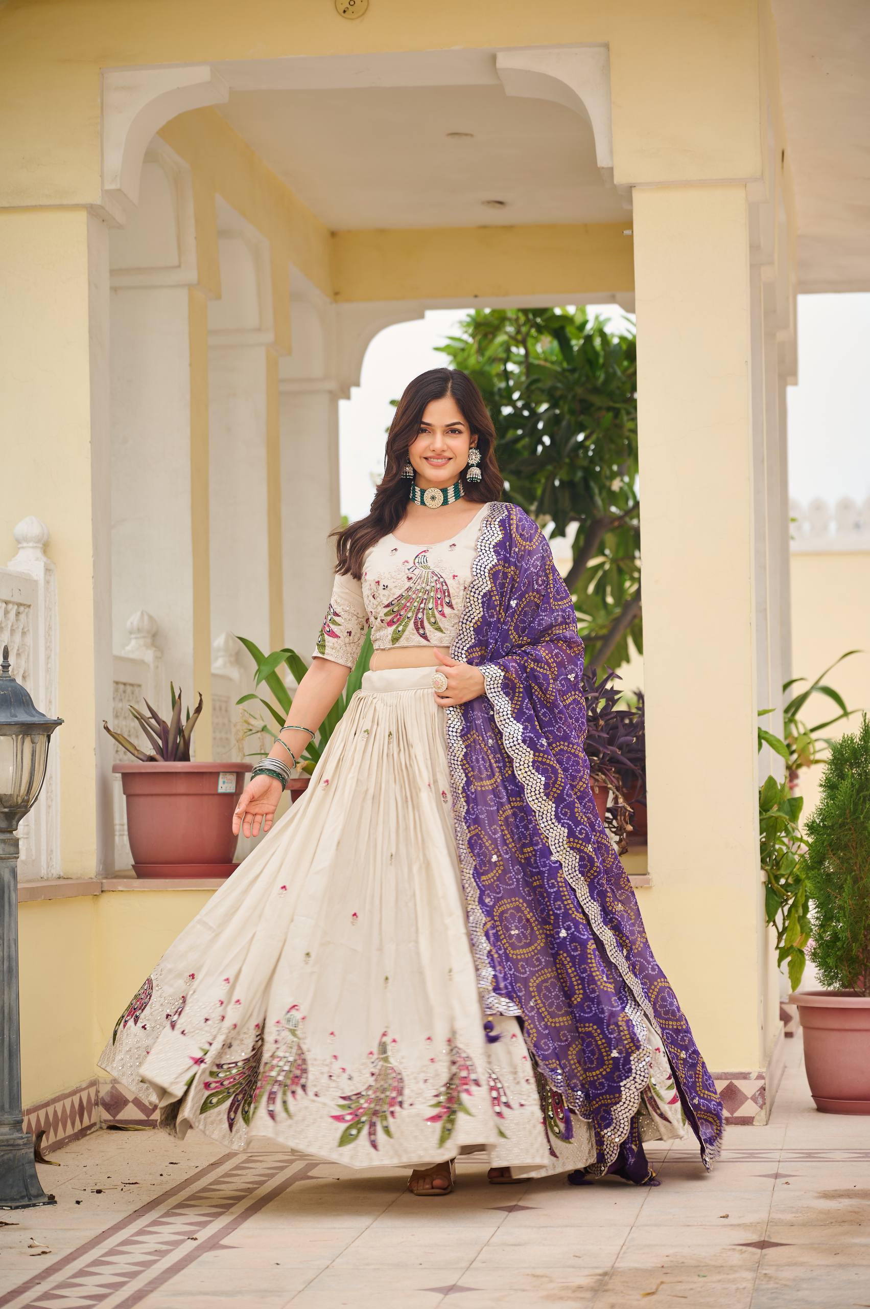 Amla off-white tissue silk lehenga choli with sequins thread work and purple Bandhej dupatta
