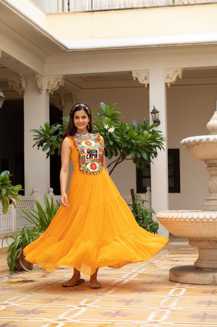 Yellow faux georgette Bandhani print Kutchi patch mirror work gown