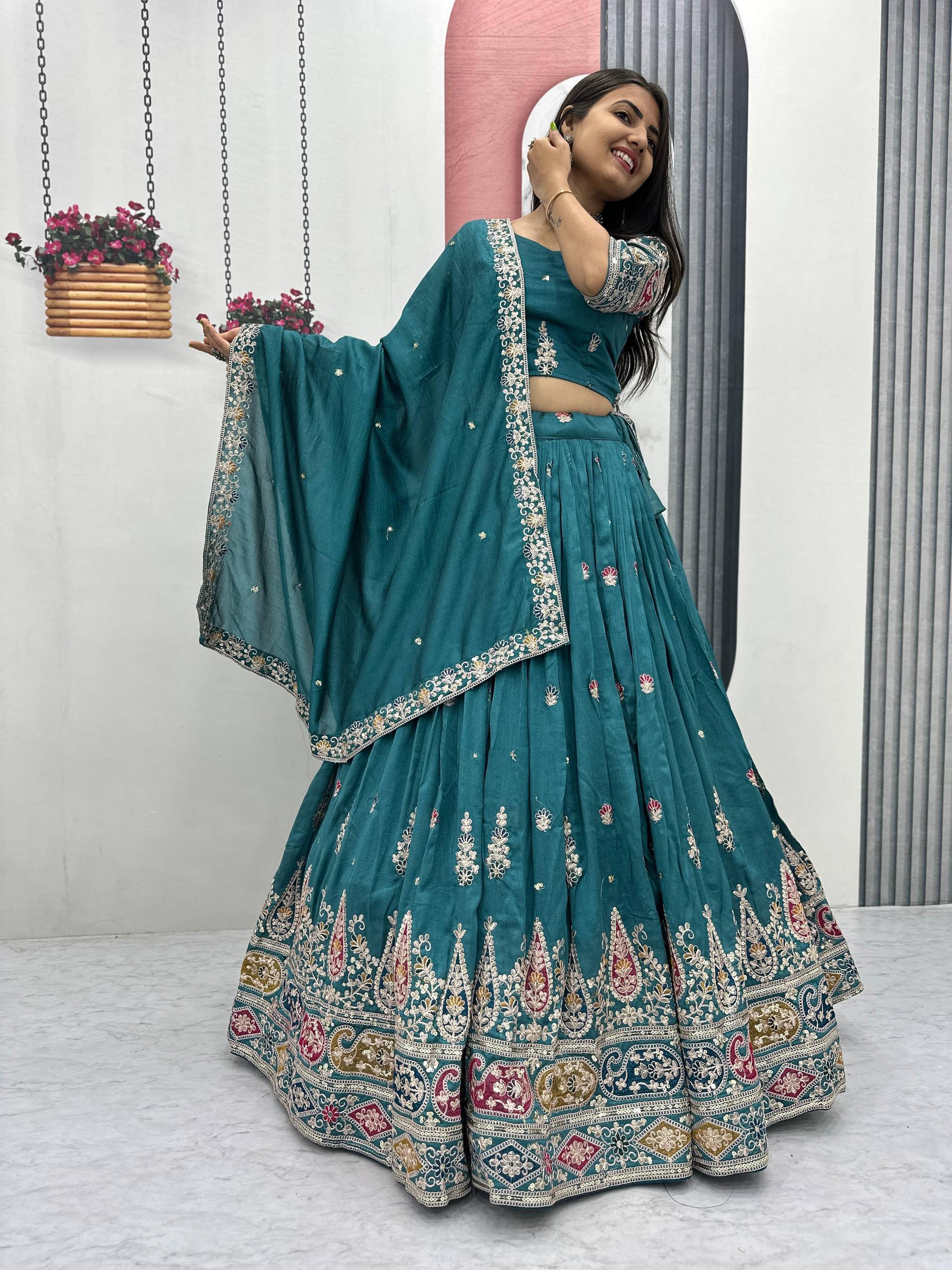 Raji teal green Vichitra silk lehenga choli with sequins thread embroidery and dupatta