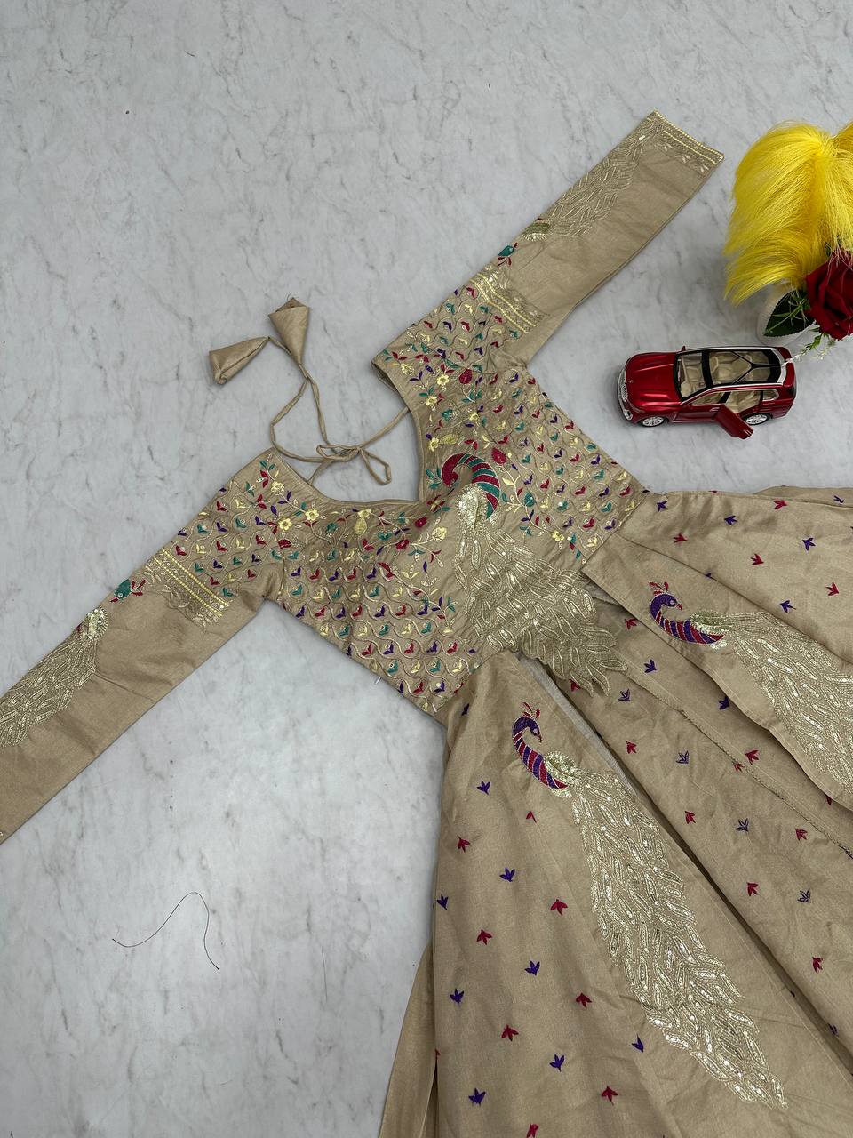 Mani beige Vichitra silk crop top peacock design lehenga with embroidered shrug