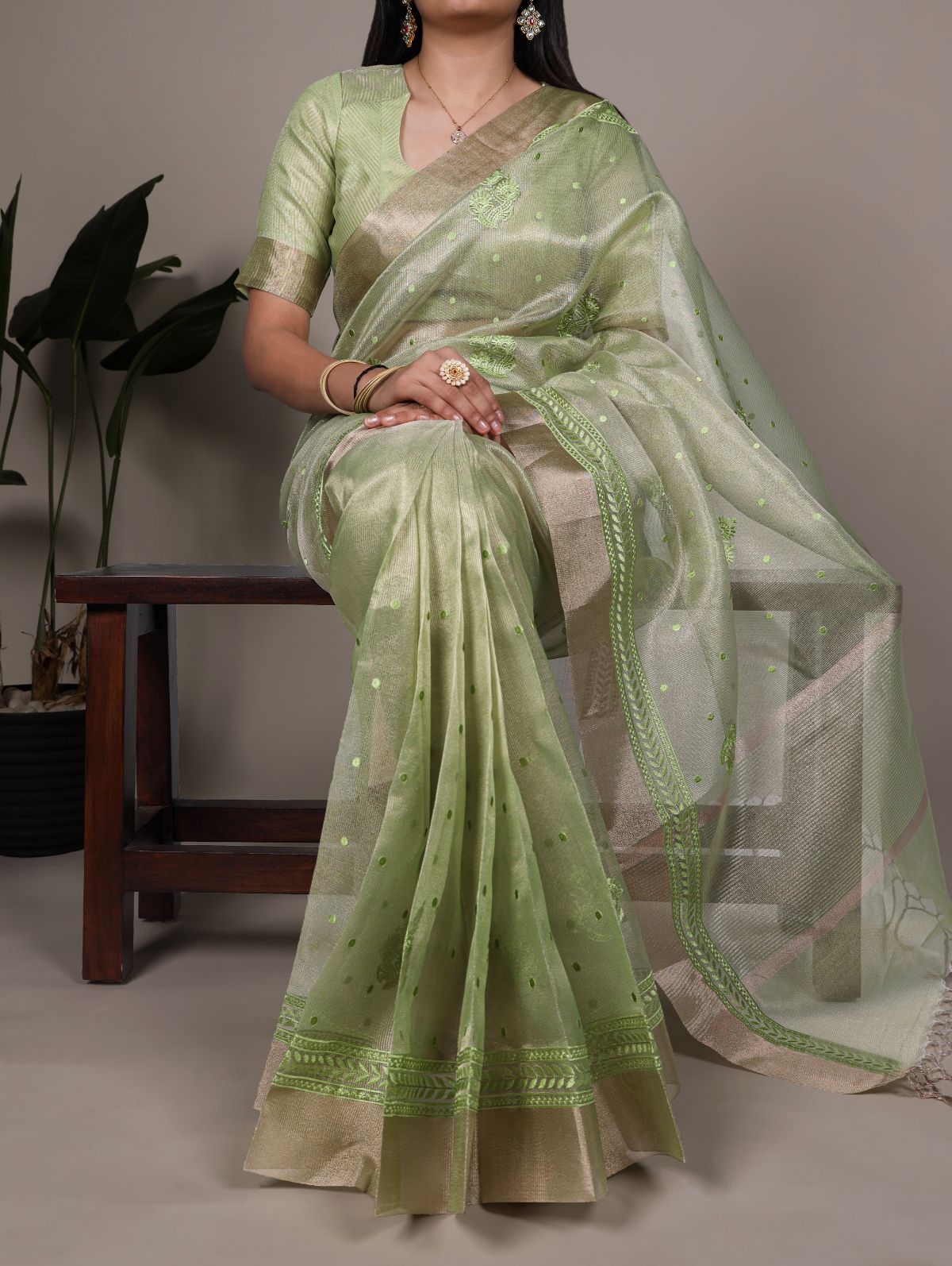 Pista green poly shimmer thread embroidered saree with unstitched blouse