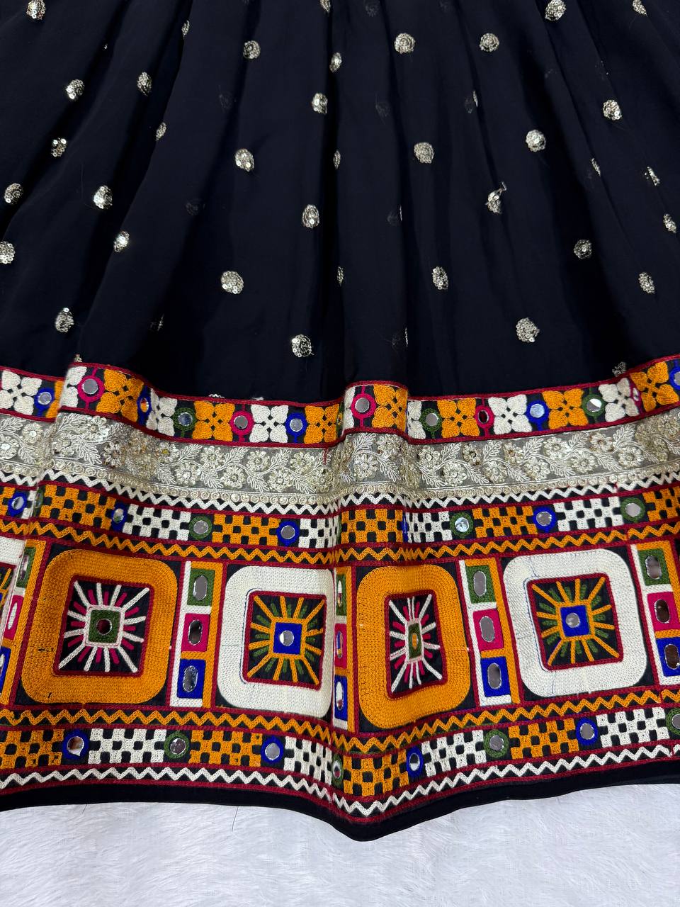 Black georgette lehenga choli with Gamthi embroidery and mirror work