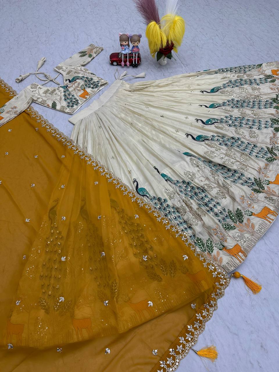 Tarini yellow tissue silk embroidered lehenga choli
