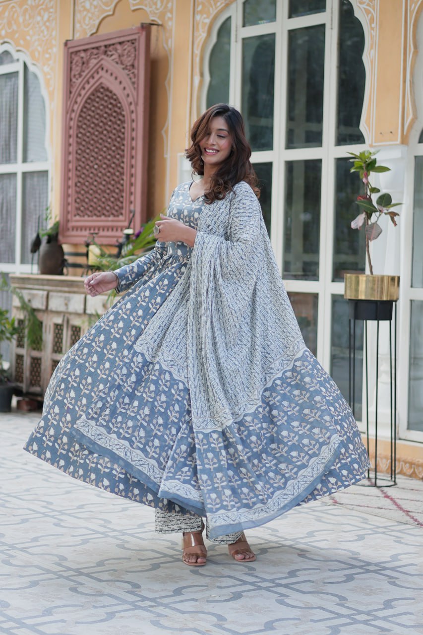 The Ridhvini Orange Cotton Anarkali Set is a stylish and comfortable ethnic wear choice for women, crafted from premium pure cotton. This readymade Anarkali suit set features a long Anarkali kurti with a fancy V-neck and full sleeves, paired with breathable cotton straight pants and a matching cotton dupatta. Ideal for daily wear, office wear, and festive occasions, this lightweight Anarkali cotton kurta set is designed for effortless elegance. Whether you're looking for a casual cotton suit, summer ethnic 