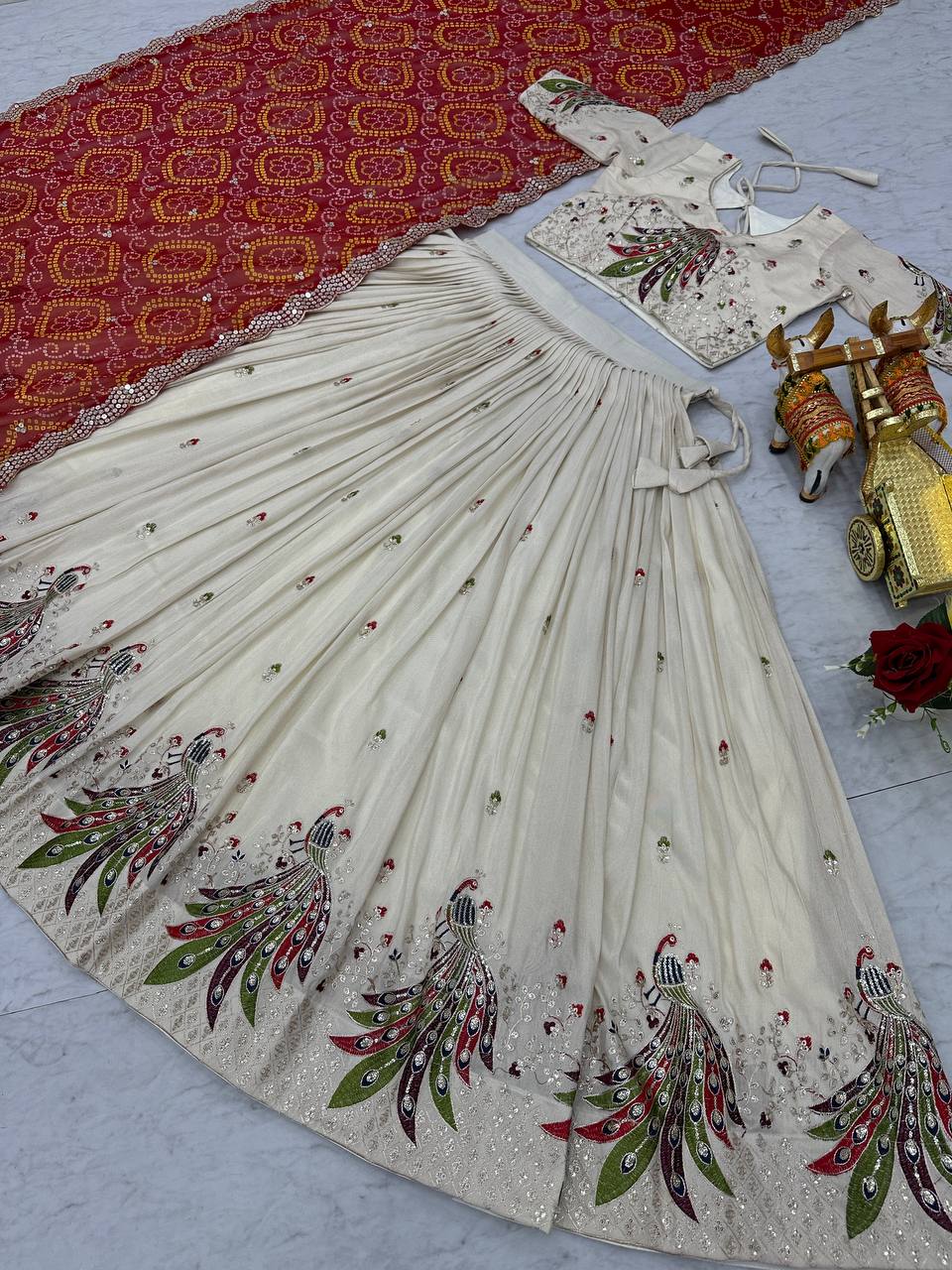 Amla off-white tissue silk lehenga choli with sequins thread work and red Bandhej dupatta