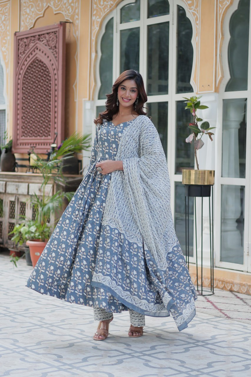 The Ridhvini Orange Cotton Anarkali Set is a stylish and comfortable ethnic wear choice for women, crafted from premium pure cotton. This readymade Anarkali suit set features a long Anarkali kurti with a fancy V-neck and full sleeves, paired with breathable cotton straight pants and a matching cotton dupatta. Ideal for daily wear, office wear, and festive occasions, this lightweight Anarkali cotton kurta set is designed for effortless elegance. Whether you're looking for a casual cotton suit, summer ethnic 