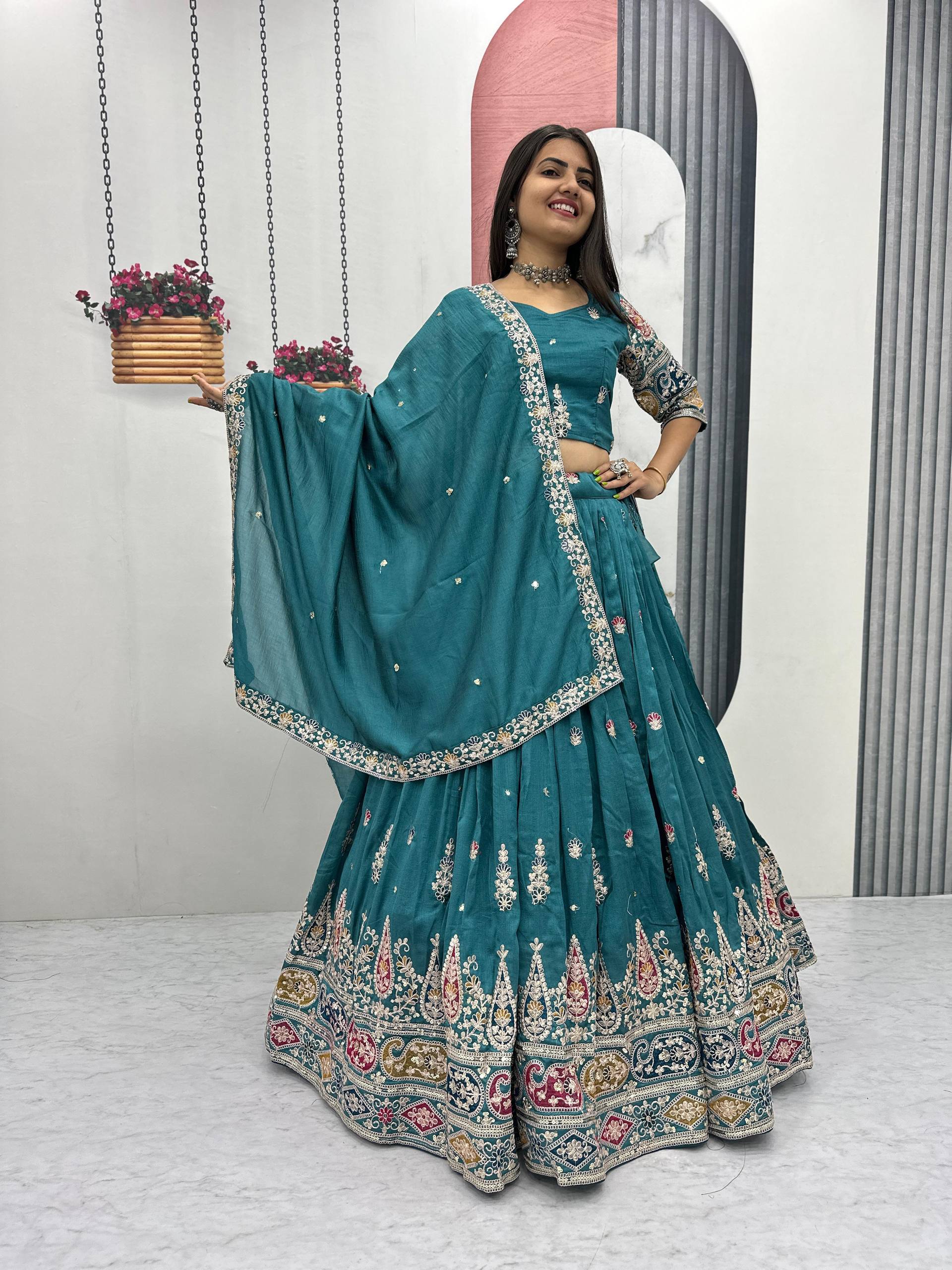 Raji teal green Vichitra silk lehenga choli with sequins thread embroidery and dupatta