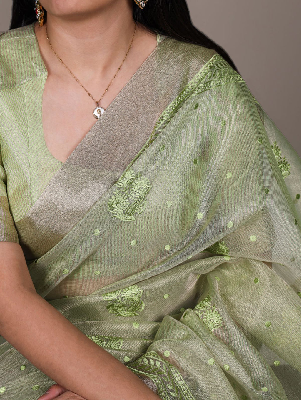 Pista green poly shimmer thread embroidered saree with unstitched blouse