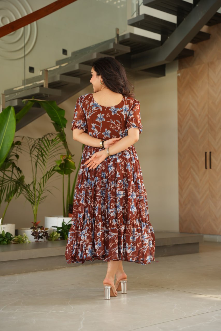 Vikarni Brown Printed Anarkali Gown in faux georgette with 12-meter flair & cotton lining – perfect for haldi, mehndi, festive & Indo-western occasions.