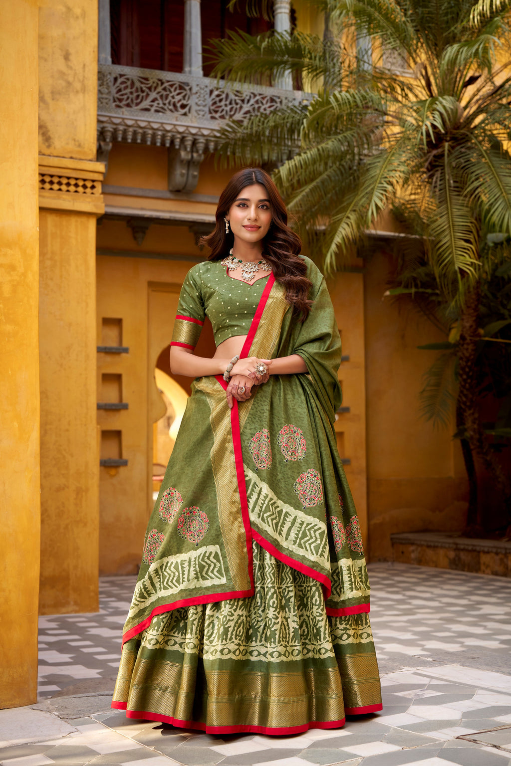 Girija mehendi green Dola silk batik print lehenga choli with zari weaving work