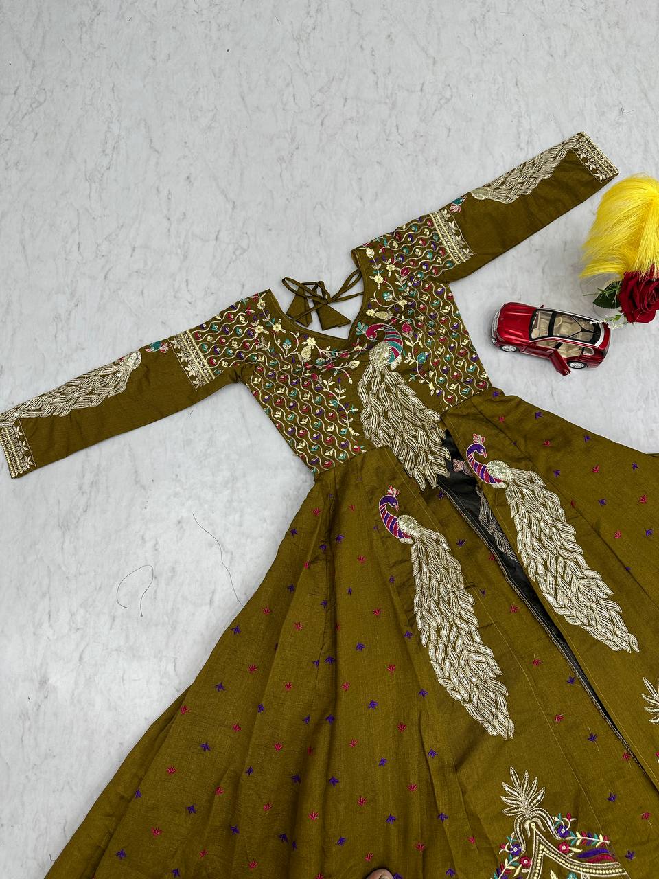 Mani olive green Vichitra silk crop top peacock design lehenga with embroidered shrug