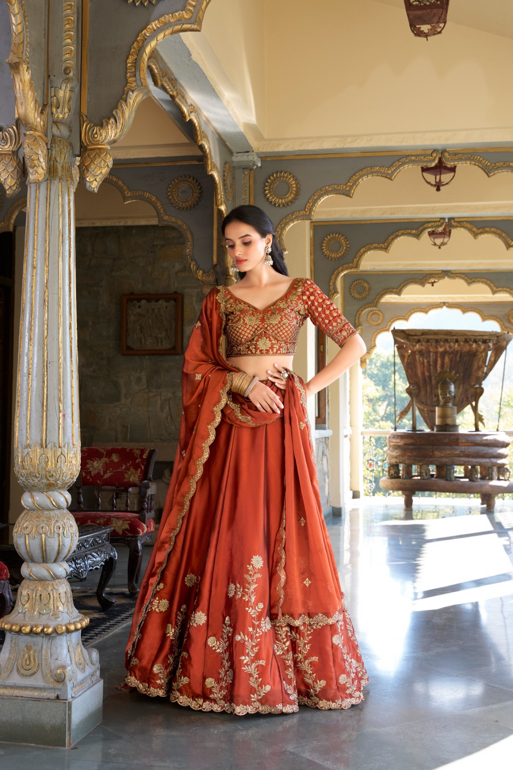 Rust orange rangoli silk lehenga choli with embroidered sequins work