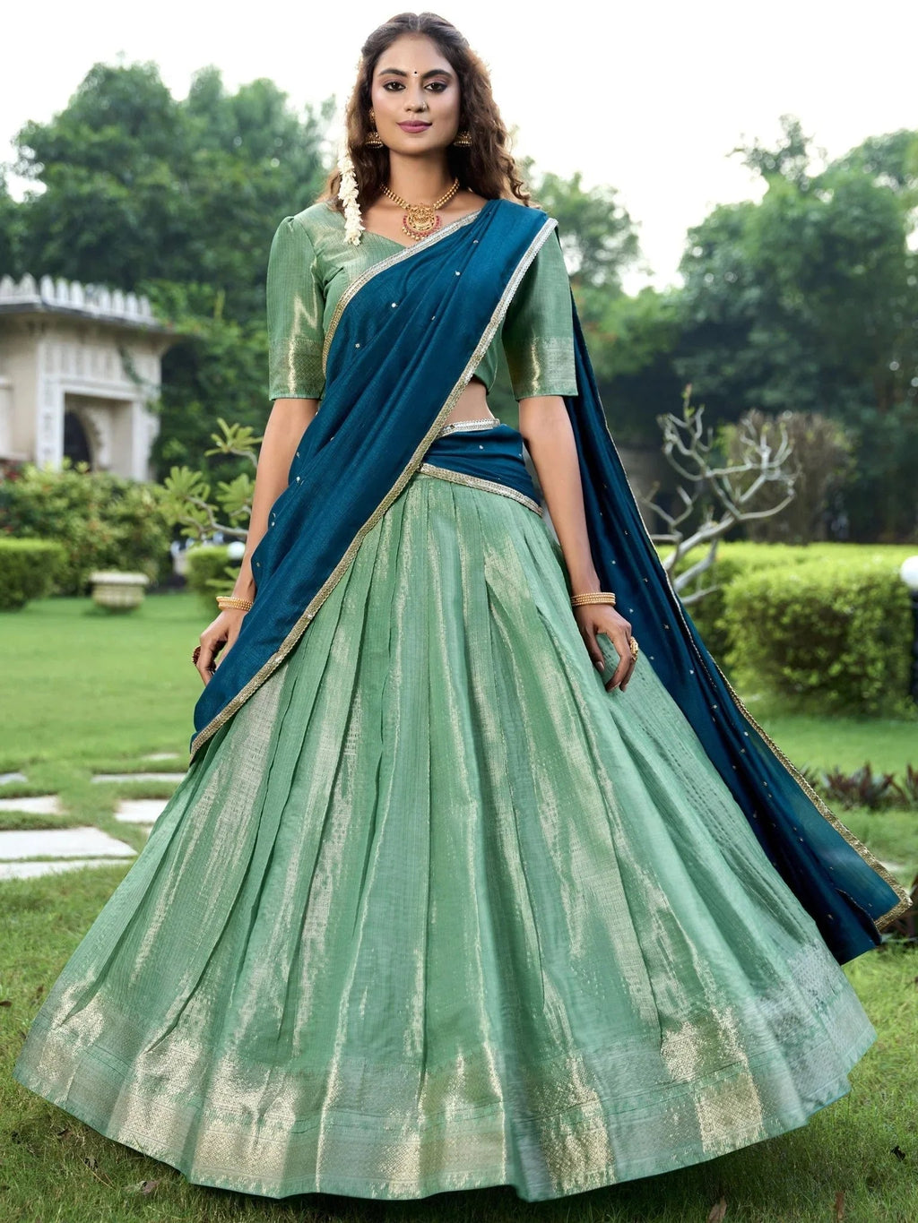 Sea green kanchipuram silk lehenga choli with zari weaving and sequins embroidery