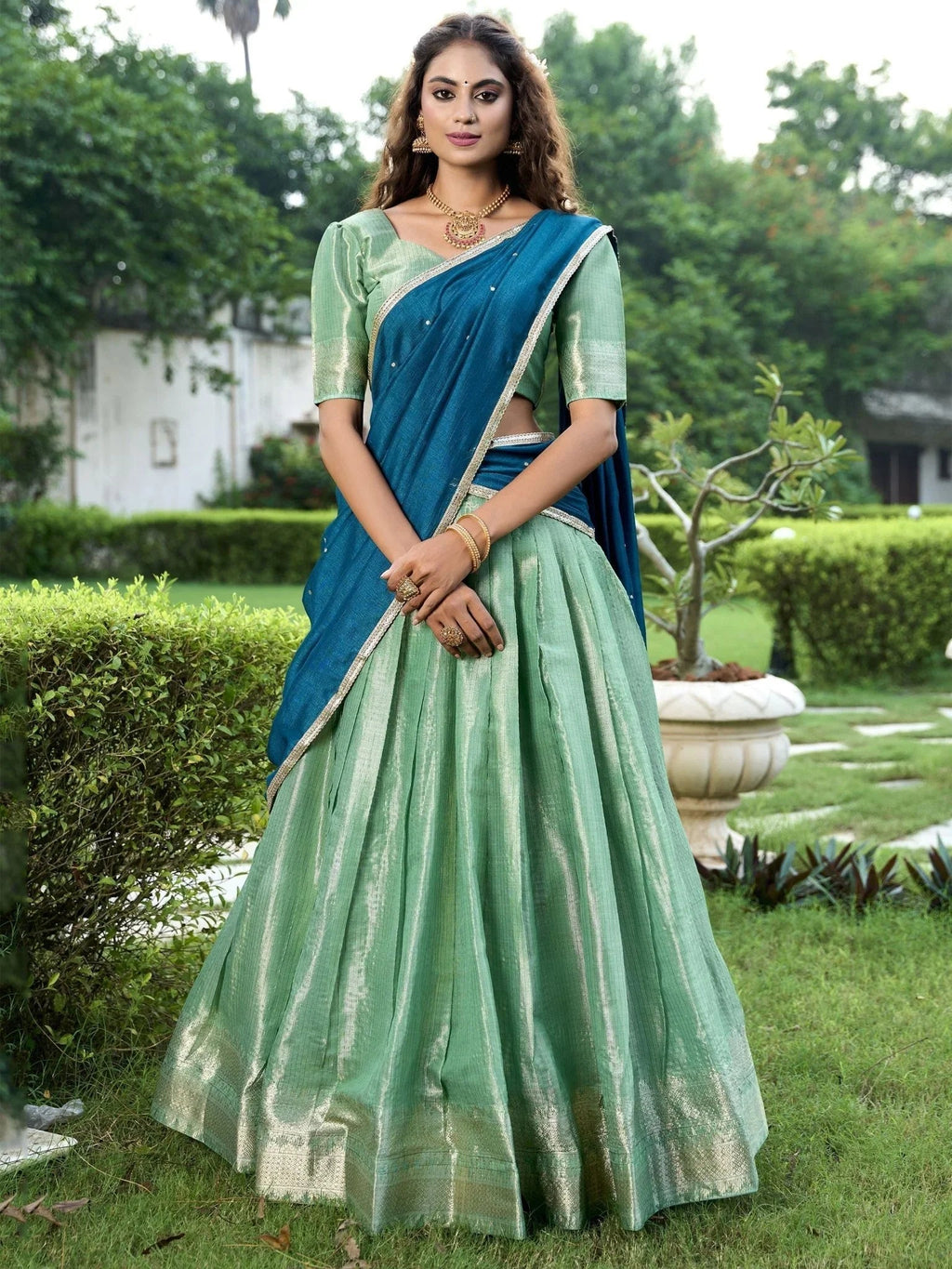 Sea green kanchipuram silk lehenga choli with zari weaving and sequins embroidery