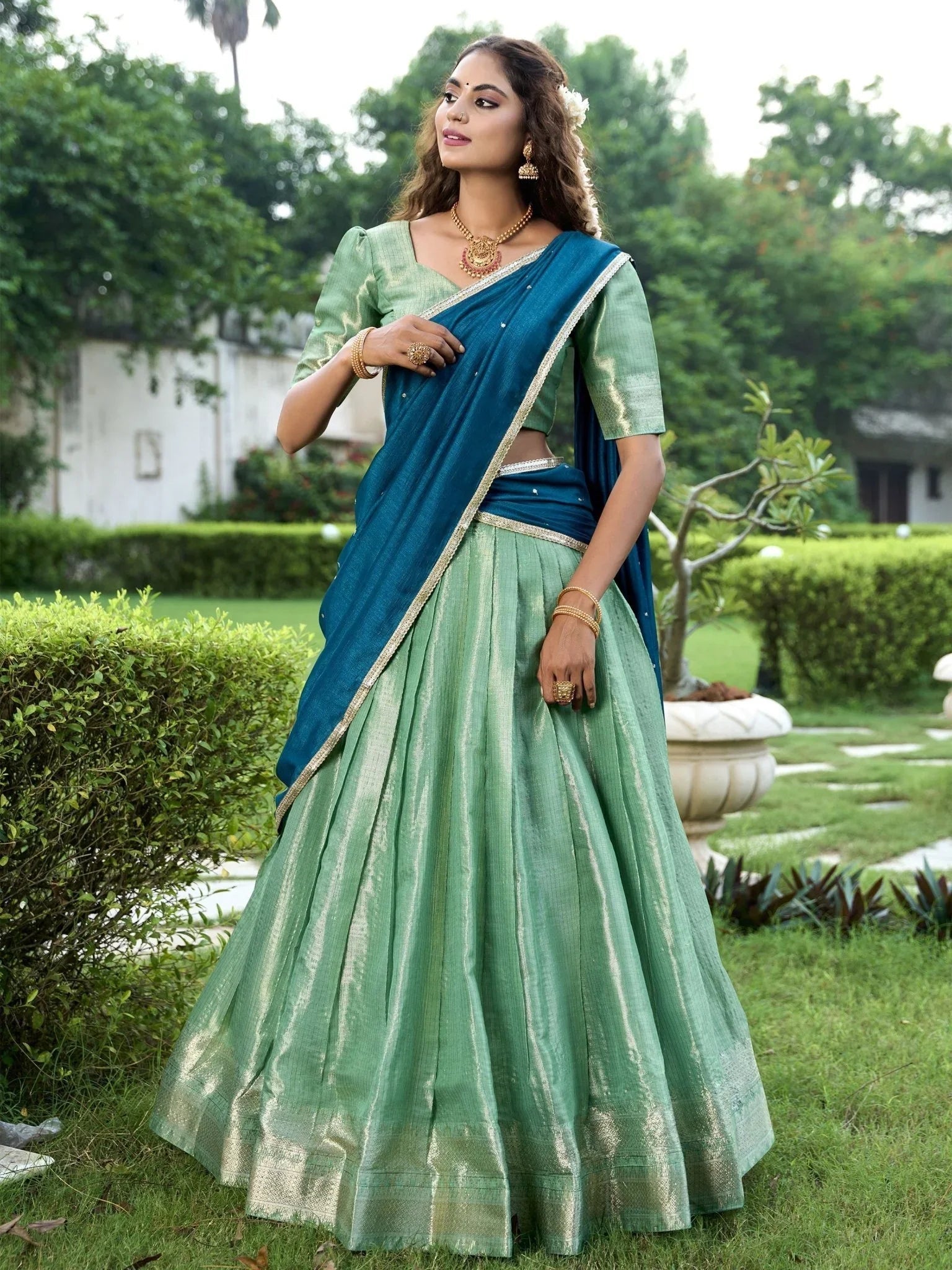 Sea green kanchipuram silk lehenga choli with zari weaving and sequins embroidery