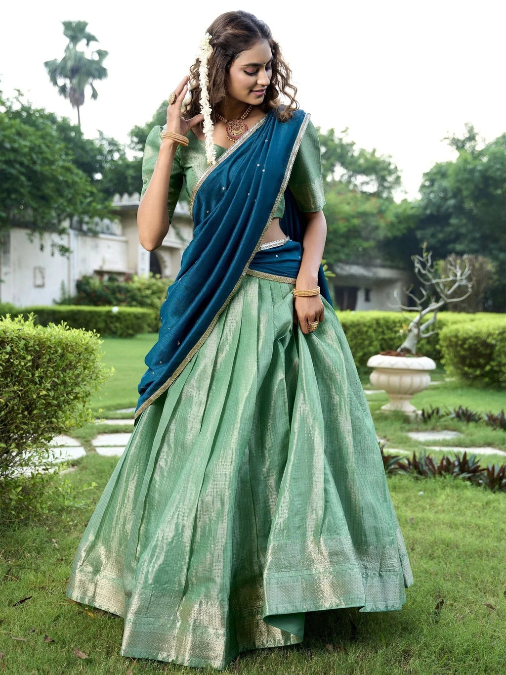 Sea green kanchipuram silk lehenga choli with zari weaving and sequins embroidery
