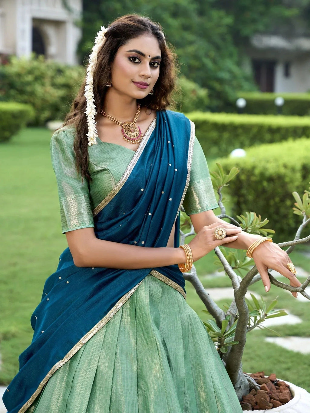 Sea green kanchipuram silk lehenga choli with zari weaving and sequins embroidery