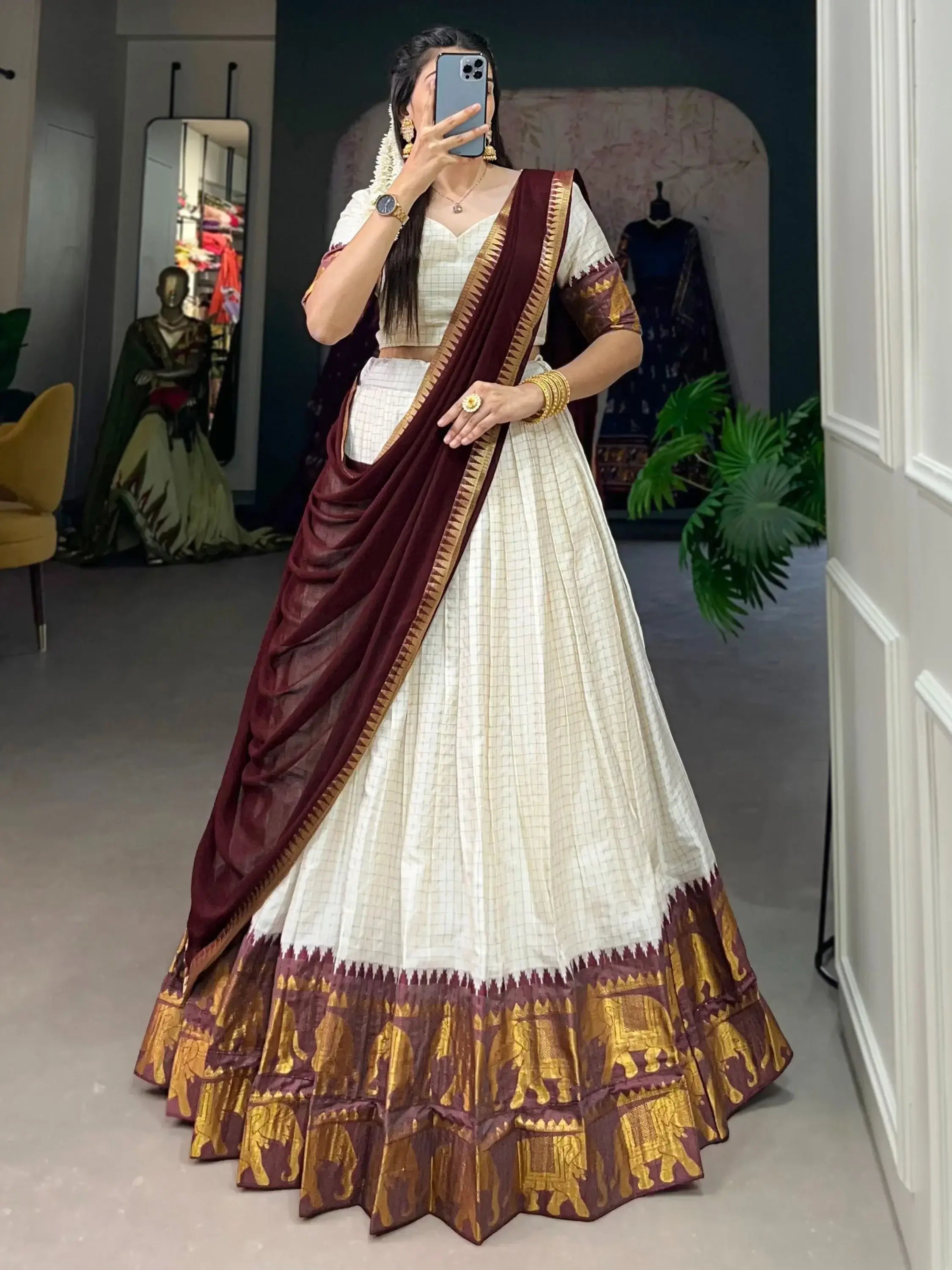 White traditional half-saree lehenga with chex pattern and zari work