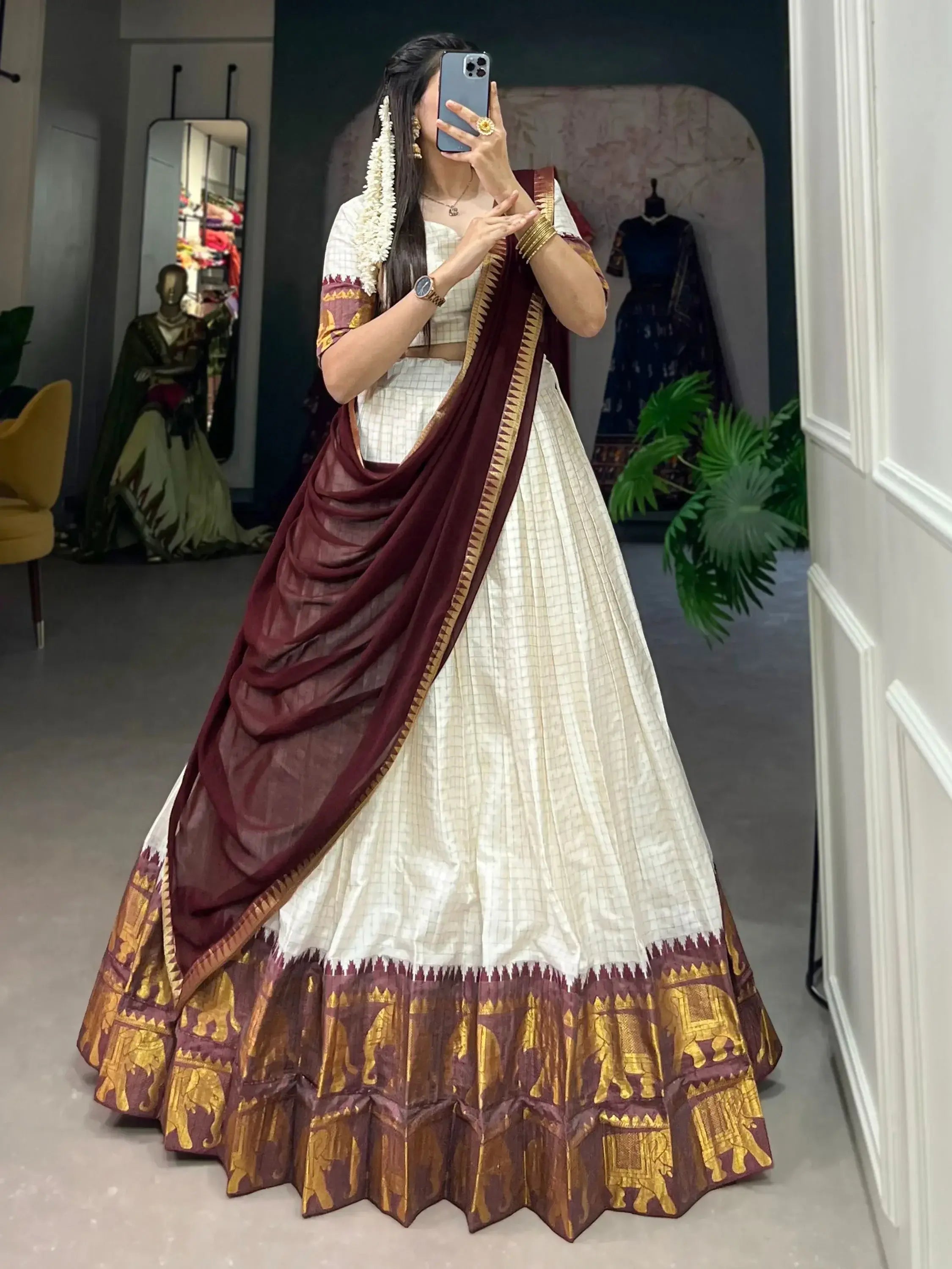 White traditional half-saree lehenga with chex pattern and zari work