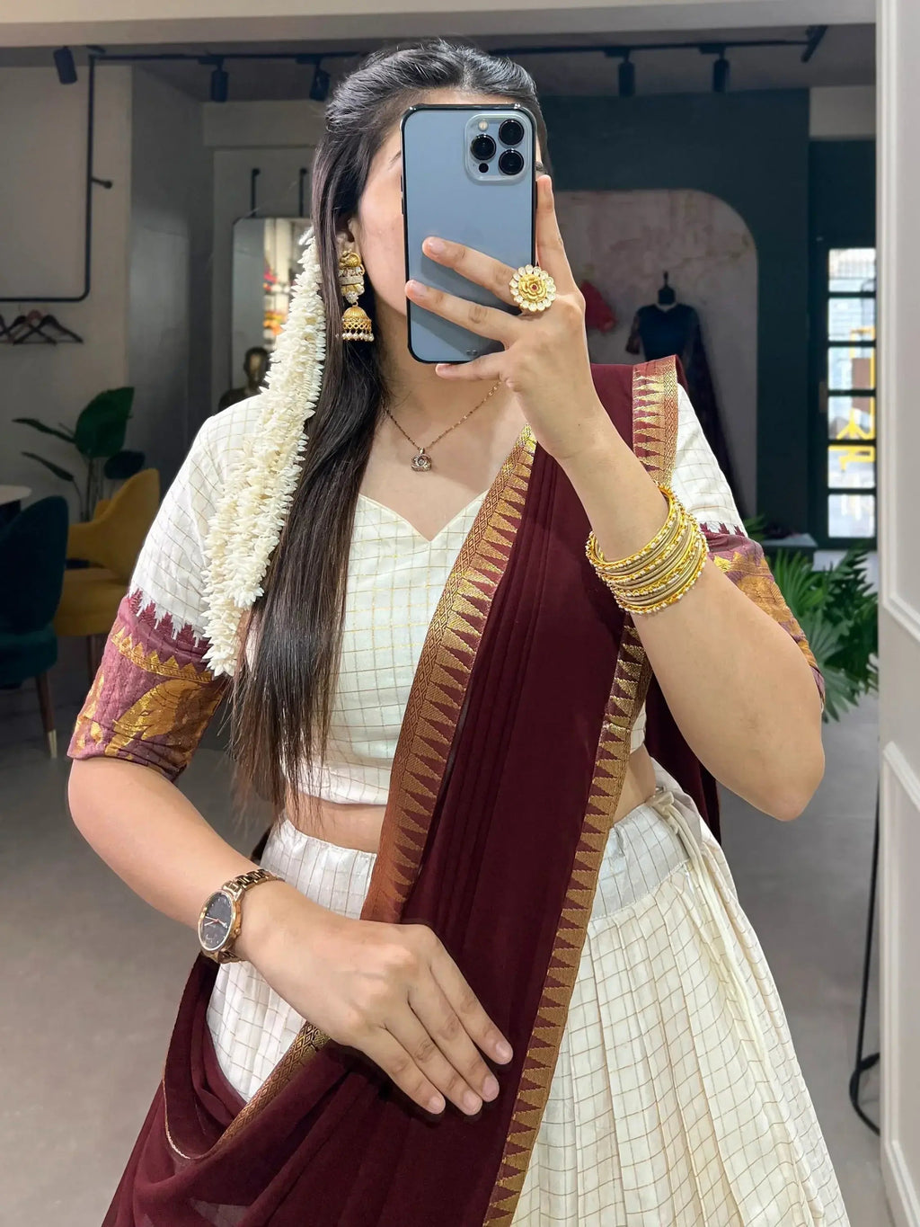 White traditional half-saree lehenga with chex pattern and zari work
